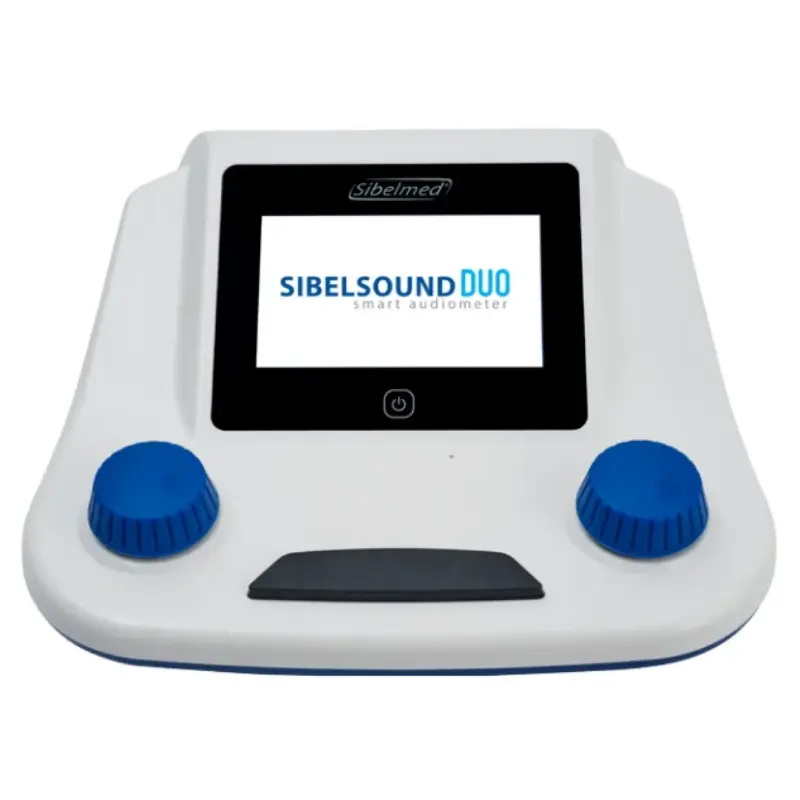 Audiómetro inteligente SIBELSOUND DUO en color blanco y negro con pantalla digital y diales de control azules sobre fondo blanco.
