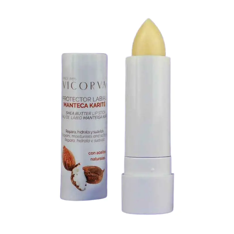Protector labial Vicorva de manteca de karité en barra blanca con estuche cilíndrico decorado con ilustraciones de frutos secos.