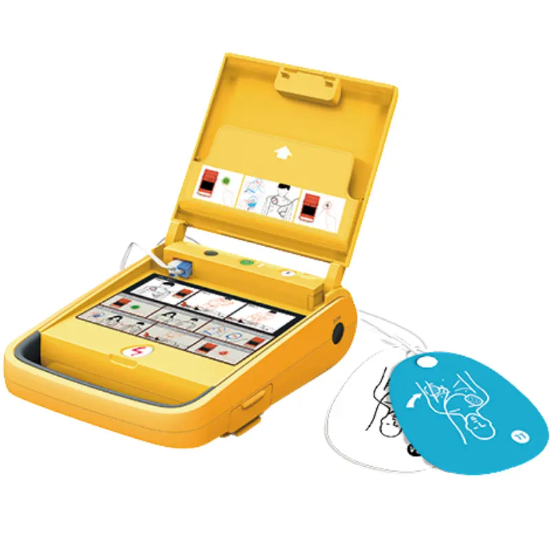 Desfibrilador externo amarillo AMOUL i3 abierto con panel de instrucciones y electrodos desplegados a su lado.