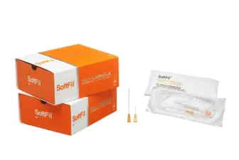 Dos cajas naranjas de microcánulas SoftFil junto a un blíster abierto con cánulas y agujas de precisión.